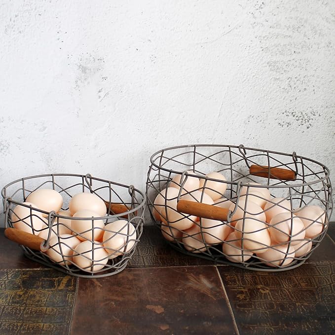 CVHOMEDECO. Oval Wire Egg Baskets Rustic Fruit Baskets with Wooden Handles Primitives Vintage Gathering Basket. Rusty, Set of 2