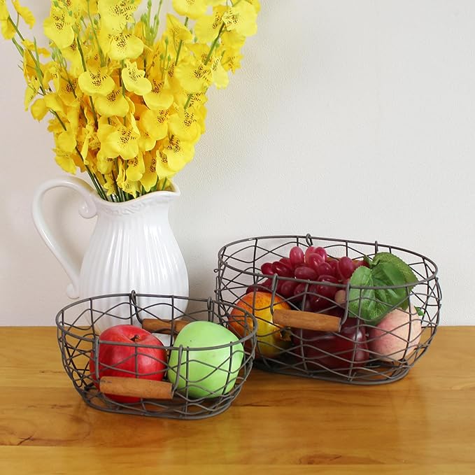 CVHOMEDECO. Oval Wire Egg Baskets Rustic Fruit Baskets with Wooden Handles Primitives Vintage Gathering Basket. Rusty, Set of 2
